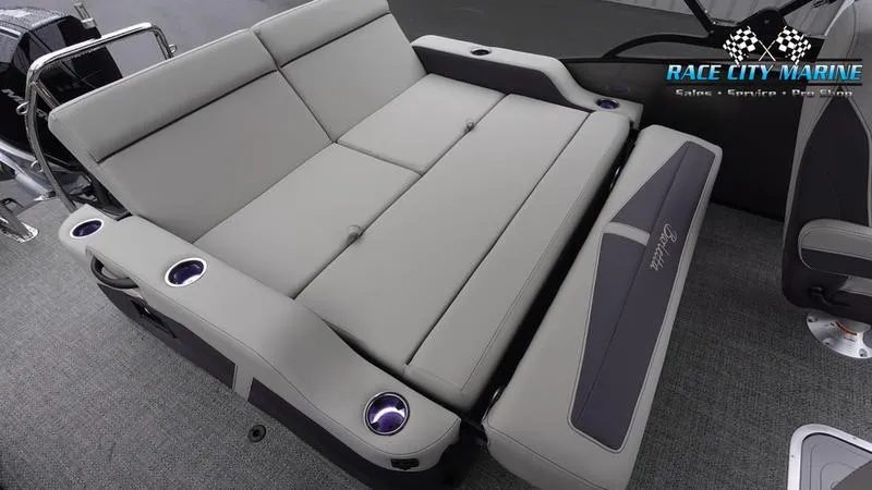 Slide: The Image of 2025 Barletta C22UC boat interior with gray seating and cup holders. - 18