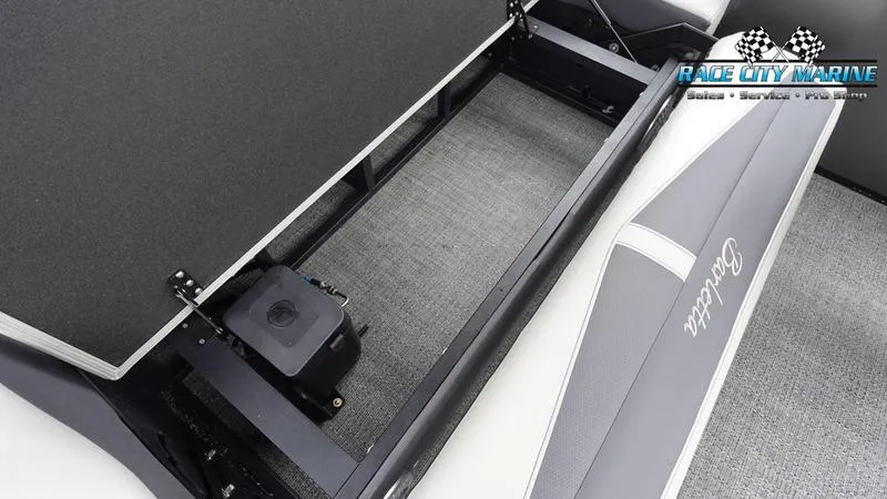 Slide: The Image of 2025 Barletta C22UC boat interior storage compartment with Race City Marine branding. - 19
