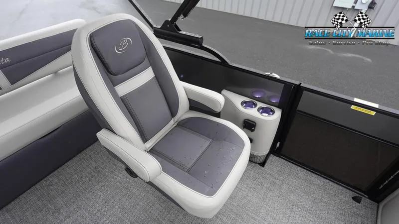 Slide: The Image of Barletta C22UC 2025 boat interior with gray captain's chair and cup holders. - 21