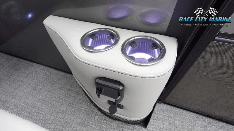 Slide: The Image of Barletta C22UC 2025 boat interior with illuminated cup holders and Race City Marine logo. - 22