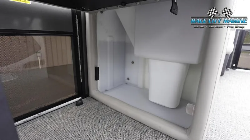 Slide: The Image of 2025 Barletta C22UC boat interior storage compartment with Race City Marine branding. - 25