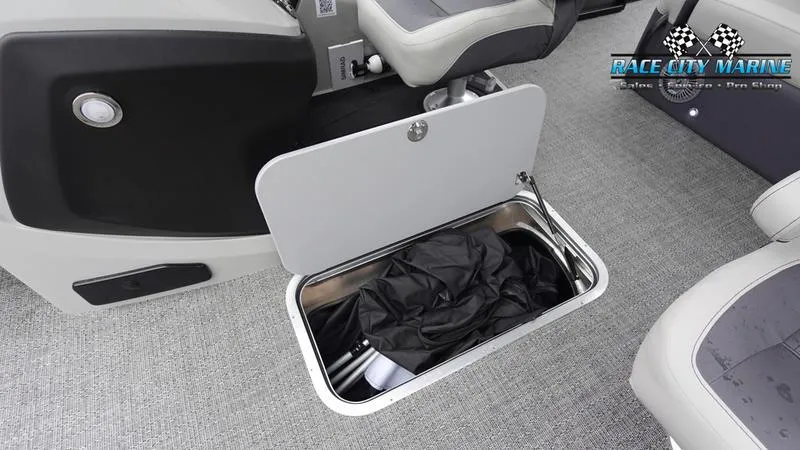 Slide: The Image of 2025 Barletta C22UC boat storage compartment with Race City Marine logo. - 27