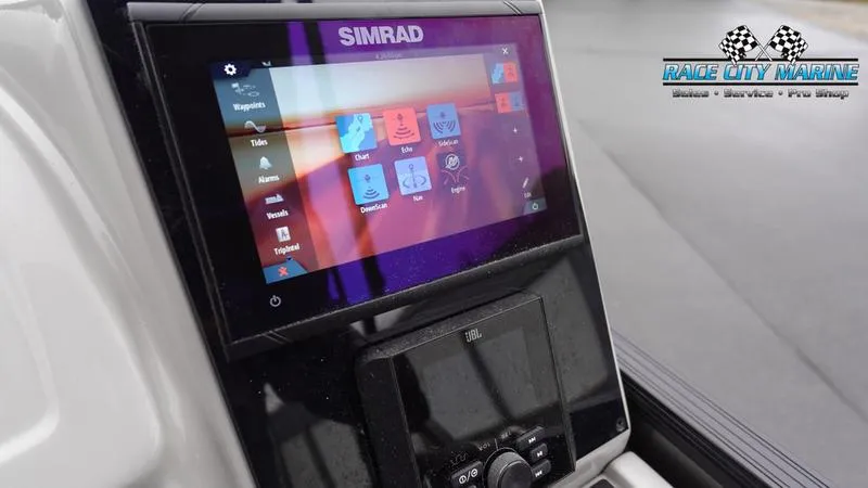 Slide: The Image of Simrad display on 2025 Barletta C22UC boat dashboard, Race City Marine branding. - 33