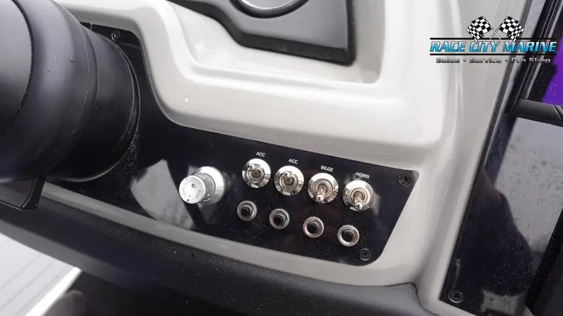 Slide: The Image of Control panel of 2025 Barletta C22UC boat with switches and knobs. - 34