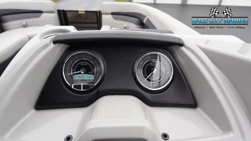 Slide: The Image of Dashboard of 2025 Barletta C22UC boat with gauges and Race City Marine logo. - 35