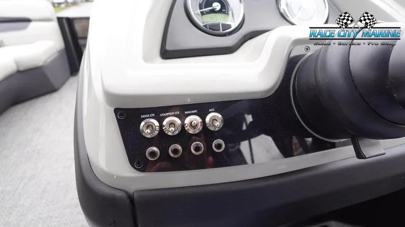 Slide: The Image of Control panel of 2025 Barletta C22UC boat with switches and gauges. - 36