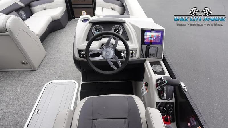Slide: The Image of 2025 Barletta C22UC boat interior with modern dashboard and steering wheel. - 38