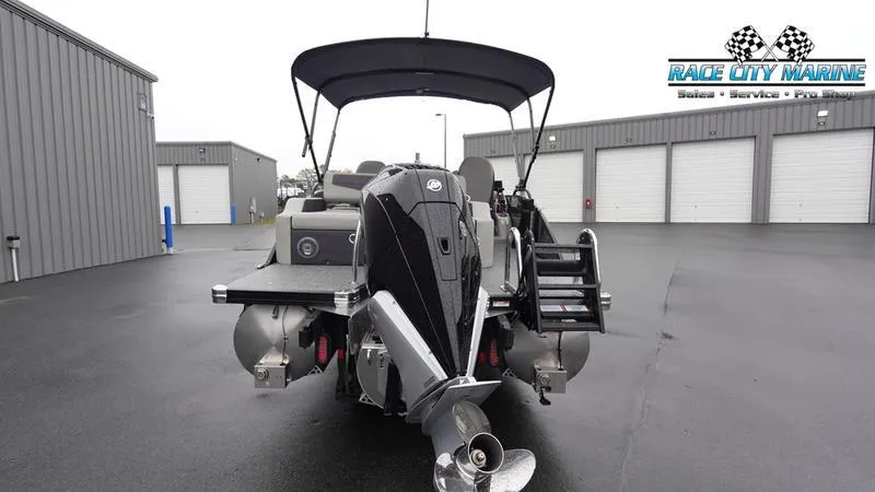 Slide: The Image of 2025 Barletta C22UC pontoon boat with outboard motor at Race City Marine. - 4
