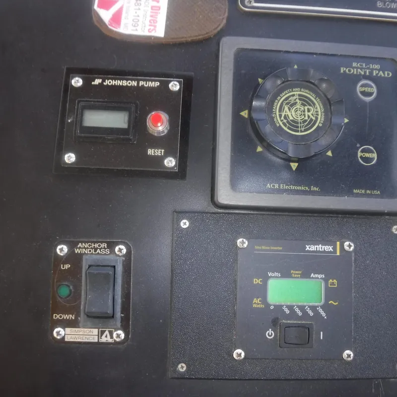 Slide: The Image of Control panel of a 1998 Legacy 40' Flybridge with various electronic devices. - 12