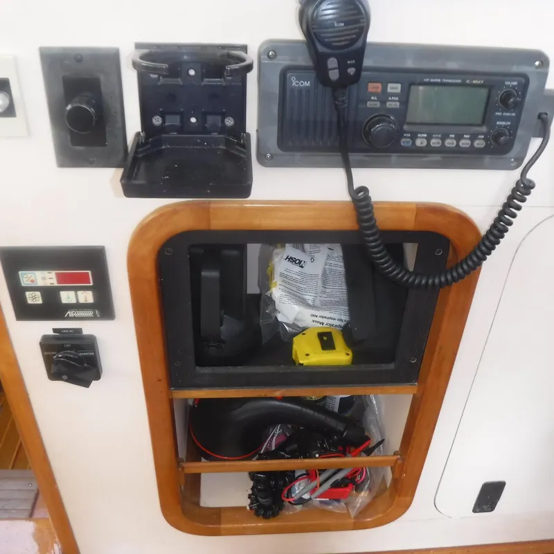 Slide: The Image of Control panel of 1998 Legacy 40' Flybridge with radio and storage compartment. - 14