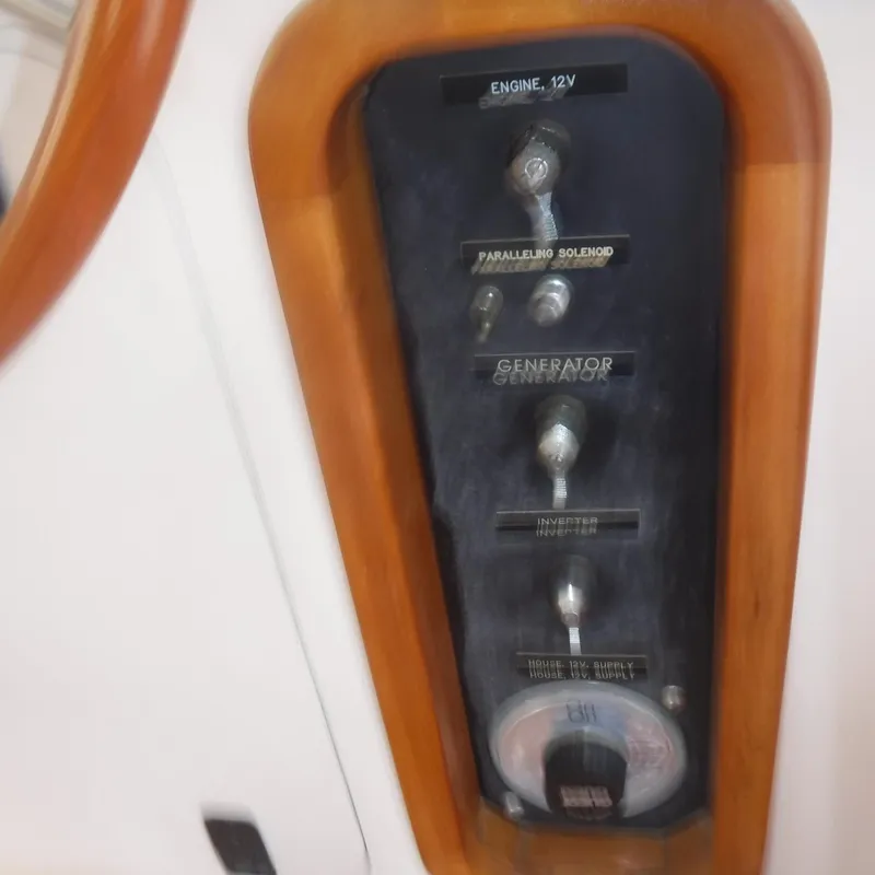 Slide: The Image of 1998 Legacy 40' Flybridge control panel with engine and generator switches. - 17