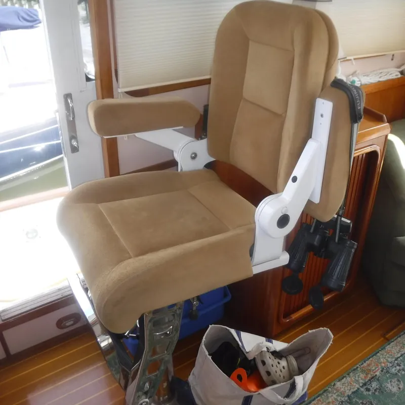 Slide: The Image of Captain's chair on 1998 Legacy 40' Flybridge yacht, beige upholstery, wooden interior. - 19