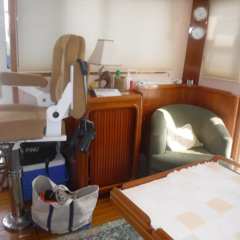 Slide: The Image of Interior of 1998 Legacy 40' Flybridge yacht with seating and wooden cabinetry. - 22