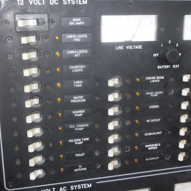 Slide: The Image of Legacy 40' Flybridge 1998 electrical panel with switches and voltage meter. - 25