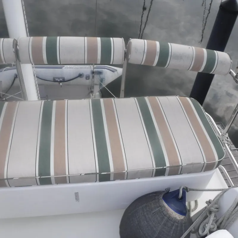Slide: The Image of Striped seating on 1998 Legacy 40' Flybridge yacht deck. - 39