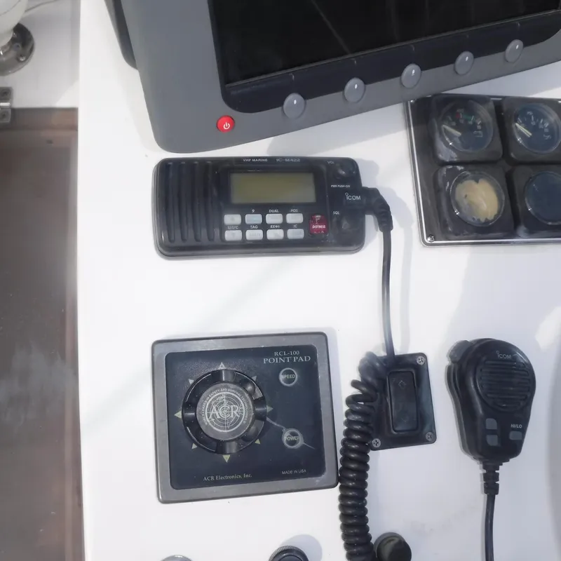 Slide: The Image of Control panel of 1998 Legacy 40' Flybridge with radio and navigation equipment. - 42