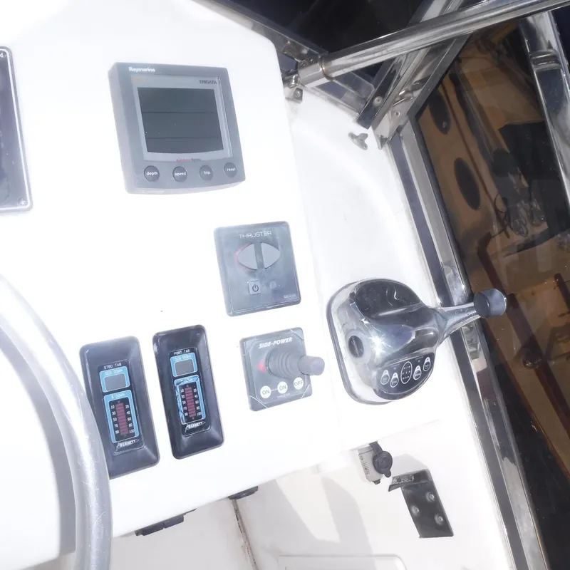 Slide: The Image of Control panel of 1998 Legacy 40' Flybridge boat with navigation instruments. - 44