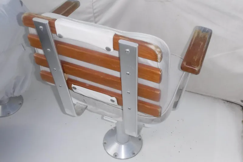 Slide: The Image of Wooden and metal boat seat on 1998 Legacy 40' Flybridge. - 46