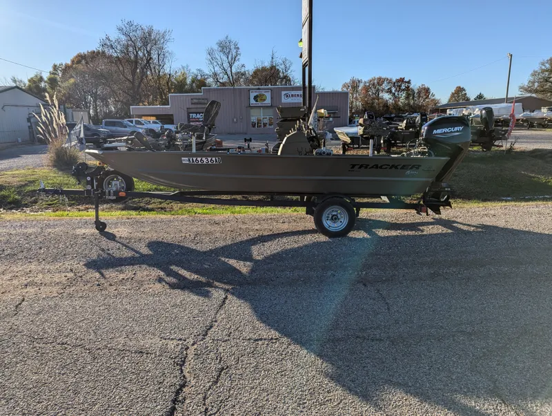 Slide: The Image of 2023 Tracker Grizzly 1648 SC boat on trailer in outdoor dealership lot. - 3