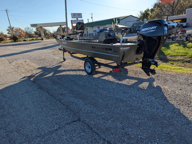 Slide: The Image of 2023 Tracker Grizzly 1648 SC boat with Mercury engine on trailer. - 4