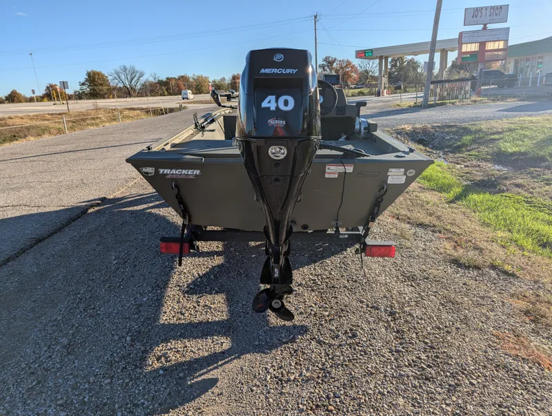 Slide: The Image of 2023 Tracker Grizzly 1648 SC boat with Mercury 40 engine on gravel road. - 6