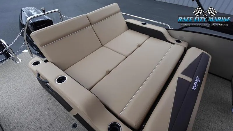 Slide: The Image of 2025 Barletta C22UC boat interior with beige seating and cup holders. - 15