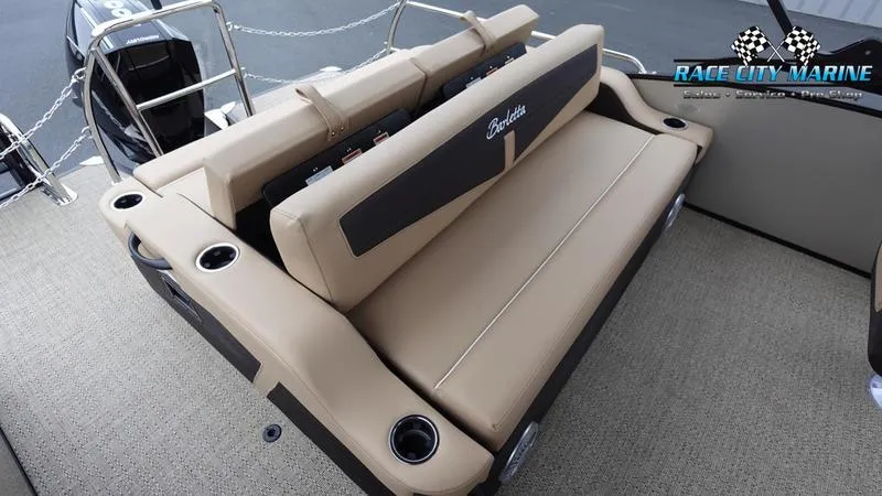 Slide: The Image of 2025 Barletta C22UC boat interior with beige seating and cup holders. - 16