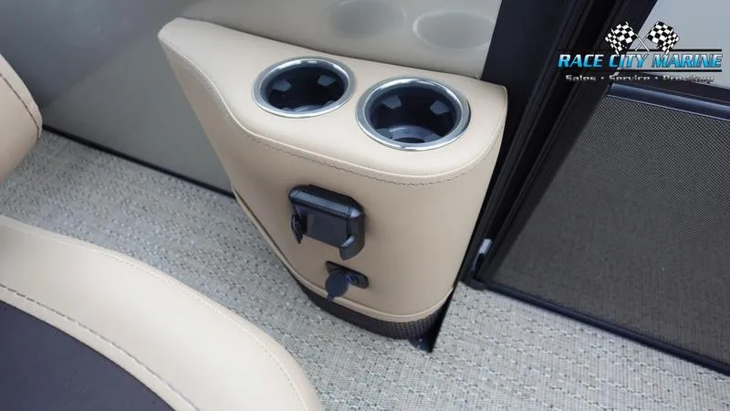 Slide: The Image of Barletta C22UC 2025 boat interior with dual cup holders and charging port. - 20