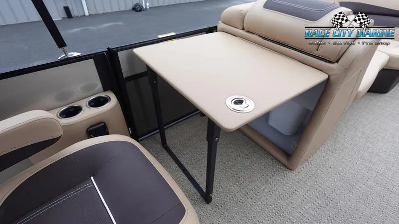 Slide: The Image of 2025 Barletta C22UC pontoon boat interior with table and seating. - 23