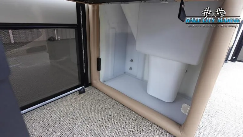 Slide: The Image of 2025 Barletta C22UC boat interior storage compartment with Race City Marine branding. - 24