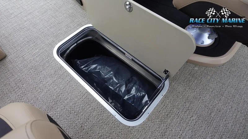 Slide: The Image of Barletta C22UC 2025 storage compartment with black bag on carpeted floor. - 25