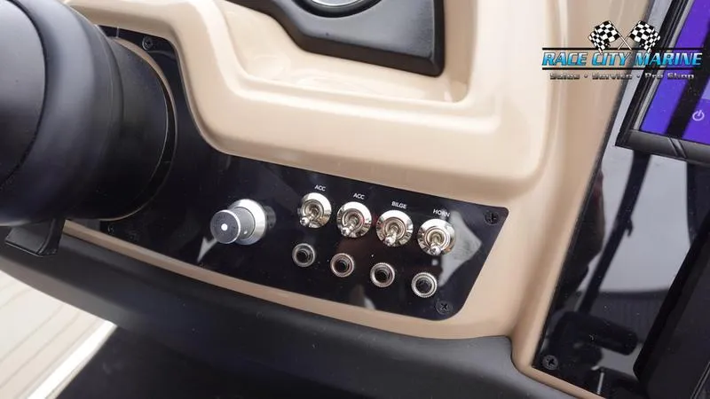 Slide: The Image of Control panel of 2025 Barletta C22UC boat with switches and knobs. - 35