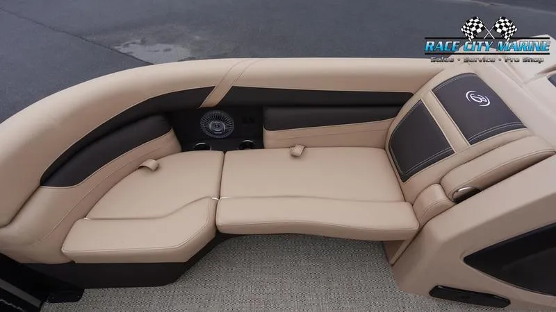 Slide: The Image of 2025 Barletta C22UC boat interior with beige seating and Race City Marine logo. - 40