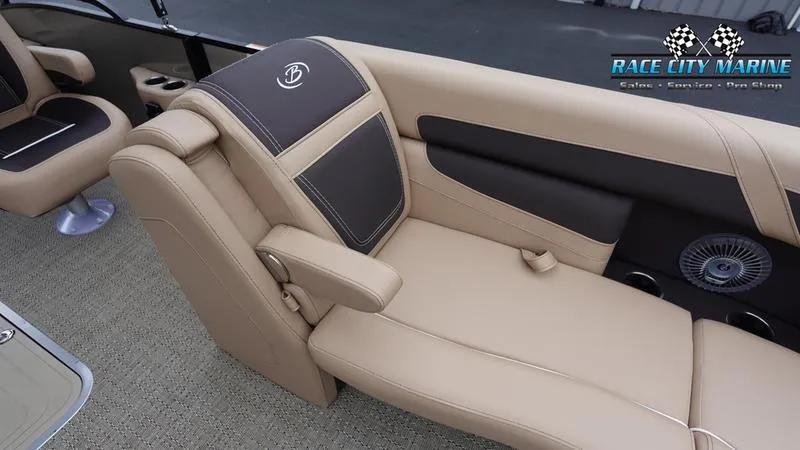 Slide: The Image of 2025 Barletta C22UC boat interior with beige and brown seating, Race City Marine logo. - 42