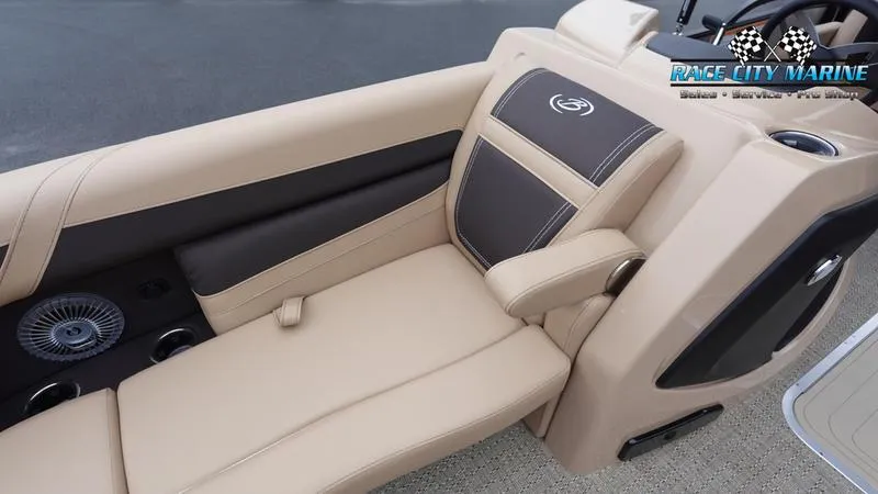 Slide: The Image of 2025 Barletta C22UC boat interior with beige and brown seating, Race City Marine logo. - 43