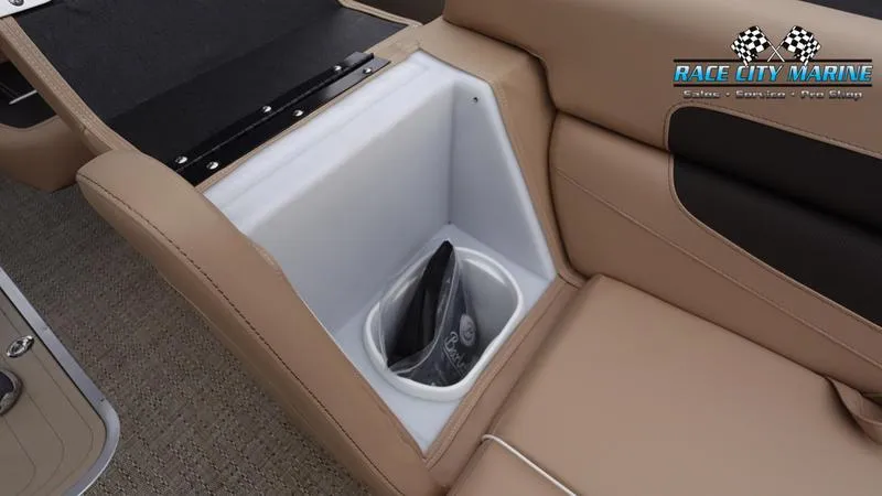 Slide: The Image of 2025 Barletta C22UC boat storage compartment with beige seating and Race City Marine logo. - 44
