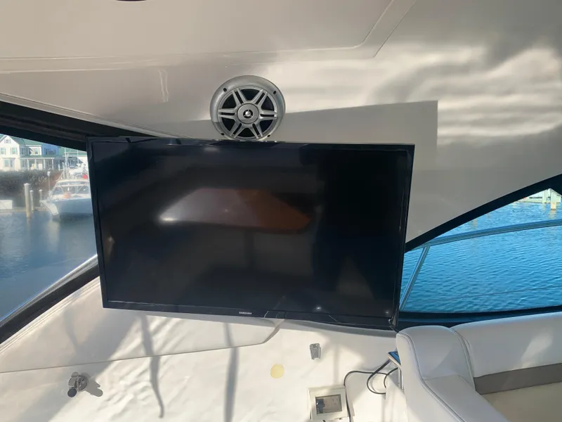 Slide: The Image of Flat-screen TV on 2014 Sea Ray 410 Sundancer yacht interior. - 16