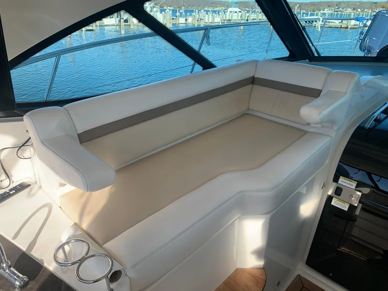 Slide: The Image of Luxurious seating area on 2014 Sea Ray 410 Sundancer yacht with marina view. - 20