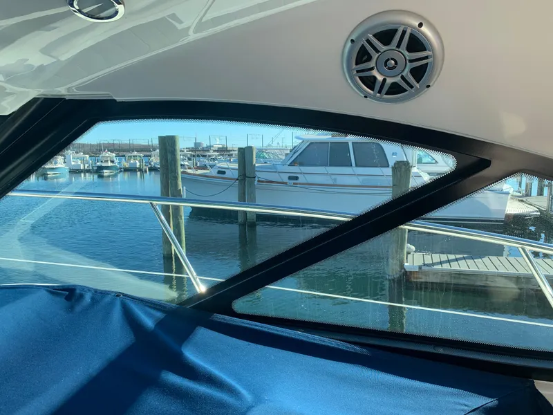 Slide: The Image of View from 2014 Sea Ray 410 Sundancer cabin overlooking marina with docked boats. - 24