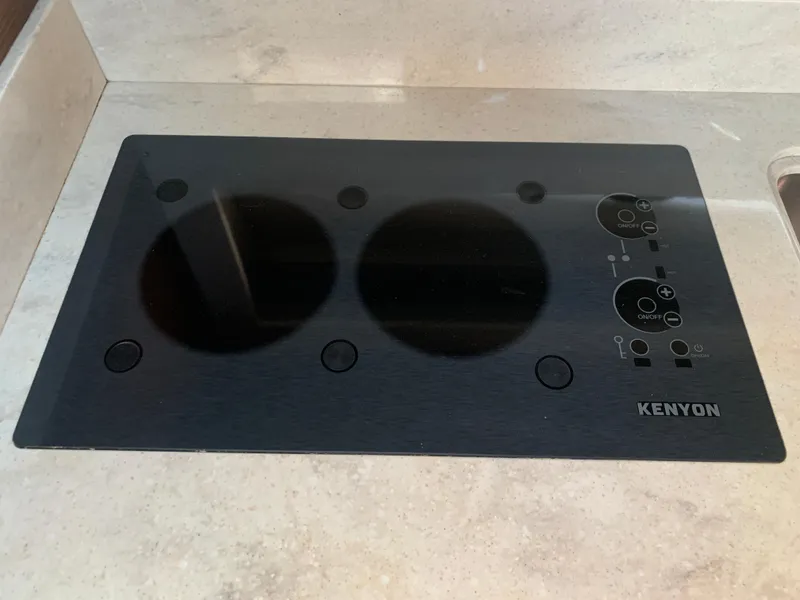 Slide: The Image of Kenyon cooktop on 2014 Sea Ray 410 Sundancer yacht kitchen counter. - 31