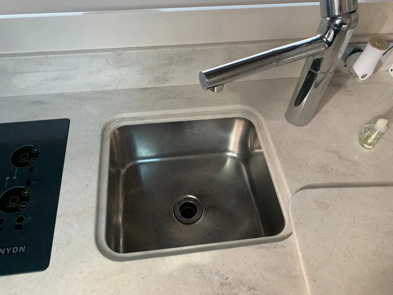 Slide: The Image of Stainless steel sink and faucet in 2014 Sea Ray 410 Sundancer yacht kitchen. - 32