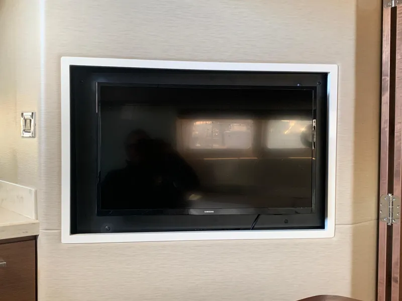 Slide: The Image of Flat-screen TV in 2014 Sea Ray 410 Sundancer yacht interior. - 44