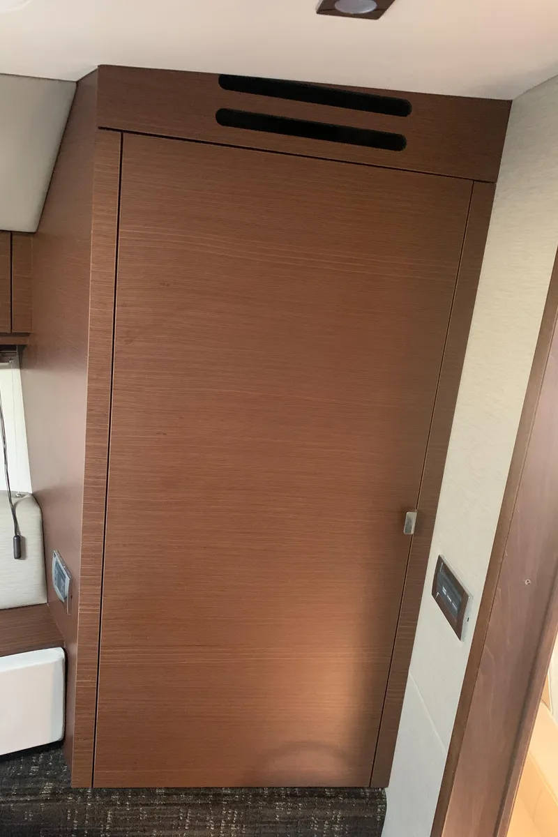 Slide: The Image of Interior of 2014 Sea Ray 410 Sundancer yacht with wooden cabinetry. - 48