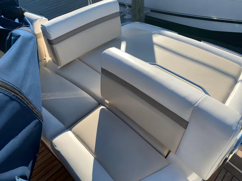 Slide: The Image of Luxurious seating on 2014 Sea Ray 410 Sundancer yacht, featuring cream upholstery. - 8