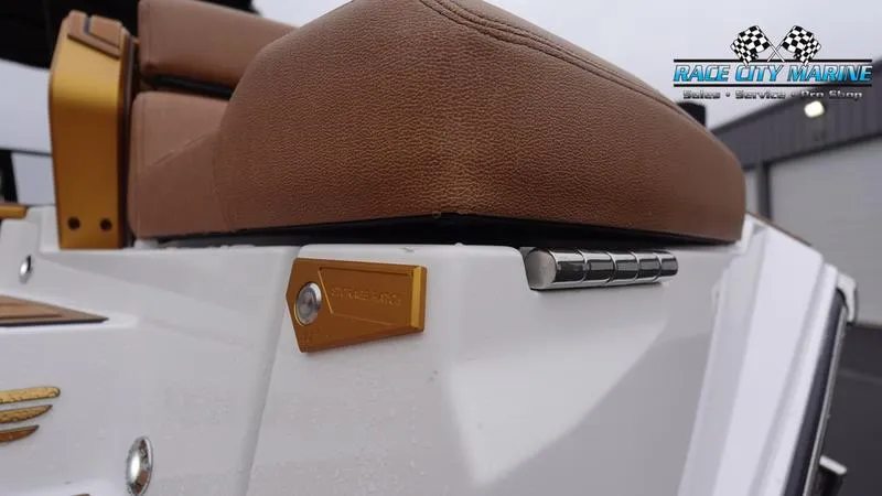 Slide: The Image of 2025 Nautique Super Air Nautique G23 Paragon boat seat detail with Race City Marine logo. - 14