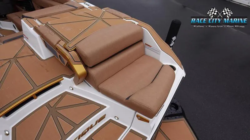 Slide: The Image of 2025 Nautique Super Air Nautique G23 Paragon boat seating with tan upholstery. - 16