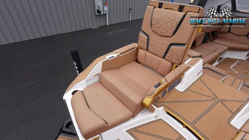 Slide: The Image of 2025 Nautique Super Air Nautique G23 Paragon luxury seating, tan upholstery, Race City Marine. - 17