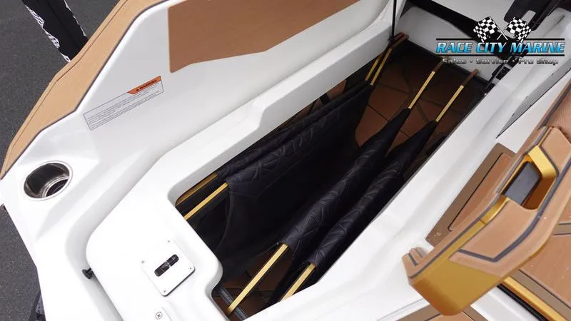 Slide: The Image of 2025 Nautique Super Air Nautique G23 Paragon storage compartment with sleek design and ample space. - 19