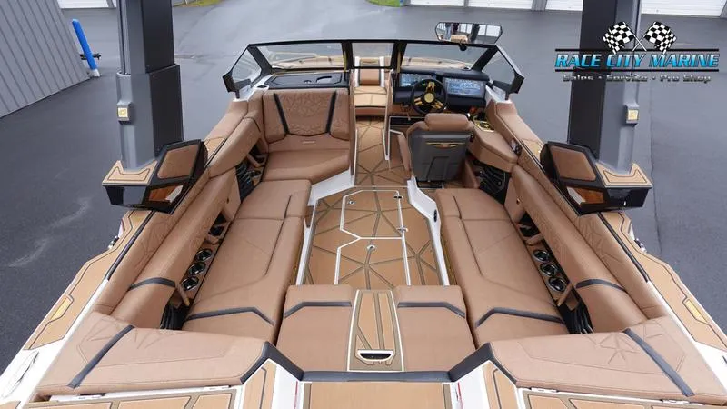 Slide: The Image of 2025 Nautique Super Air Nautique G23 Paragon interior with luxurious seating and modern design. - 24