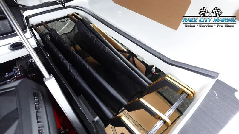 Slide: The Image of 2025 Nautique Super Air Nautique G23 Paragon storage compartment with equipment. - 29